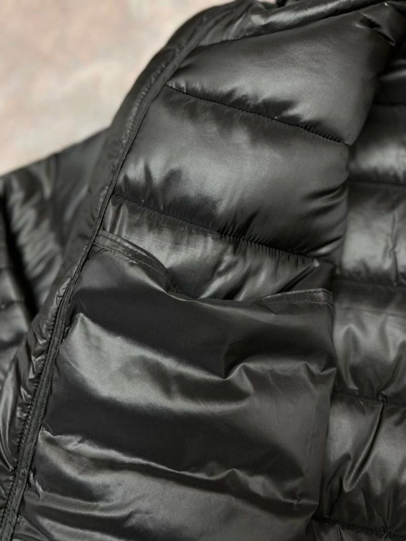 Stay warm and stylish in cold weather with the Canada Goose Glossy Black Puffer Jacket. Featuring a lightweight quilted design with premium insulation, a protective hooded collar, and signature branding accents, this outerwear piece combines everyday functionality with luxury cold-weather style. - Image 7